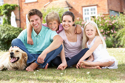 image of family in front of house